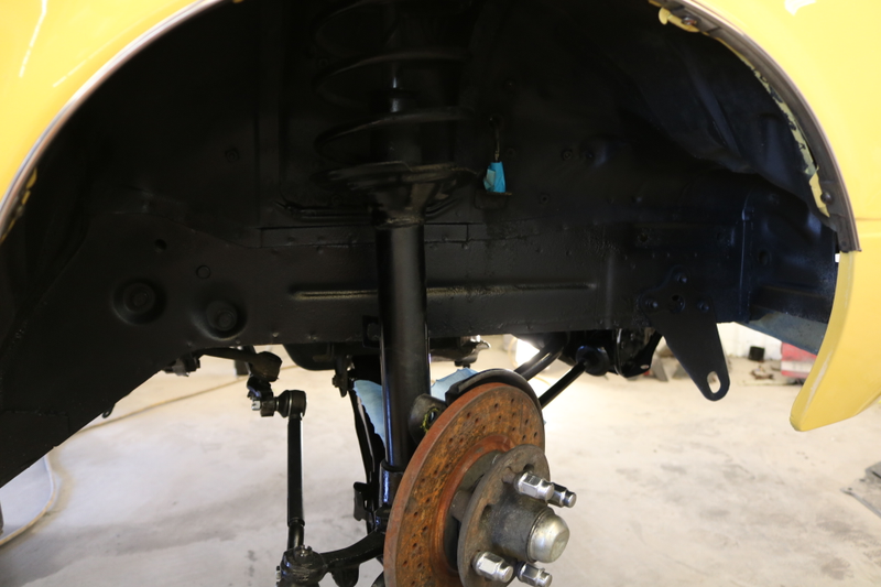 Painted wheel well and suspension.